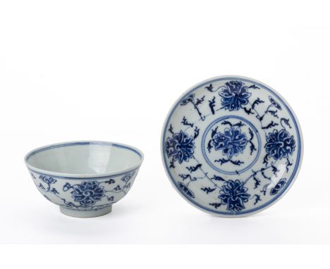 A BLUE AND WHITE LOTUS BOWL AND SIMILAR SAUCER
The bowl bearing a stylised Kangxi mark, the saucer with six character Guangxu