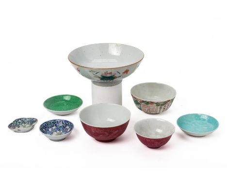 A GROUP OF PORCELAIN BOWLS AND DISHES
Including a large bowl (hairline crack to rim and a further repaired crack), a pink gla