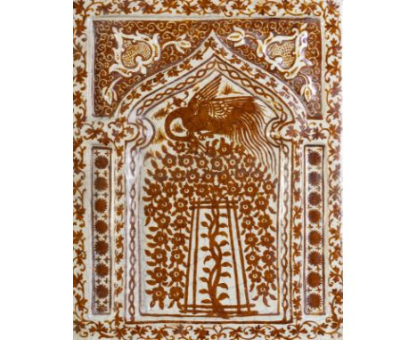 Islamic Art A lustreware mihrab tile painted in the Ilkhanid style with a simiurgh Qajar Iran, 19th century . . Cm 30,00 x 38
