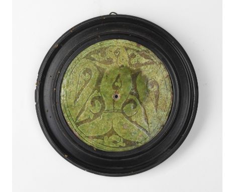 Islamic Art A Garrus round tile with carved through decoration with birdIran, 12th-13th century . . Cm 12,50.