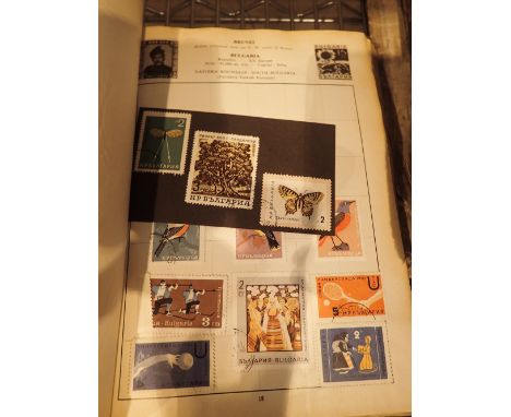 Vintage postage stamp album with worldwide contents