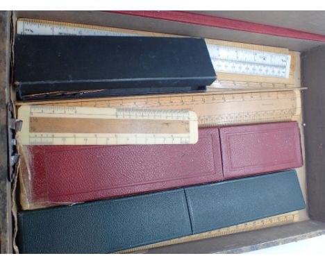 Box of mixed vintage wooden rulers drawing instruments slide rules etc