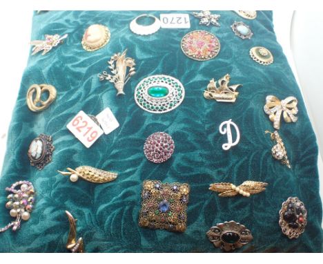 Cushion of various brooches