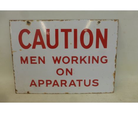 A 'Caution Men Working on Apparatus' rectangular enamel sign, 14 x 10". 