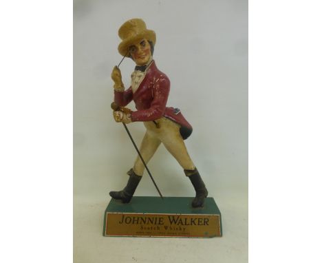 A Johnnie Walker Scotch Whisky advertising figure. 