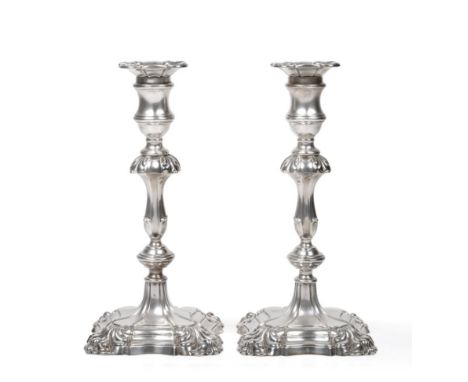 A Pair of George II Style Silver Candlesticks, Hawksworth, Eyre & Co Ltd, Sheffield 1917, shaped square bases with foliate co