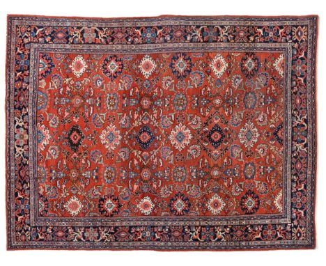 Sultanabad Carpet West Iran, circa 1930 The abrashed strawberry field with an all over design of large polychrome flower head