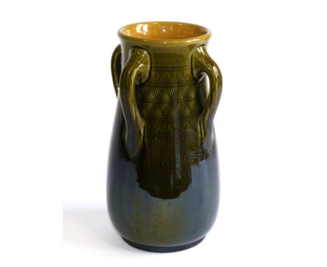 Christopher Dresser (Scottish, 1834-1904): A Linthorpe Pottery Four-Handled Vase, with repeating patterns, green and mustard 