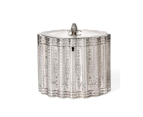 A George III Silver Tea Caddy, Robert Hennell, London 1786, of wavy oval outline with bright engraved decoration, the hinged 