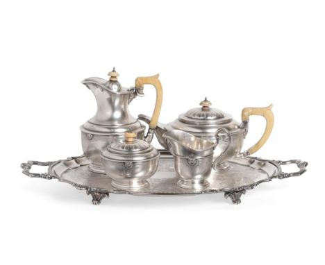 A George V Silver Four Piece Tea Service, James R Ogden, London 1931, of circular form, the shoulder applied with shells and 