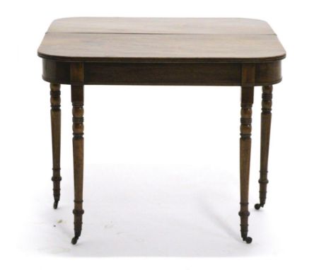 A Mahogany Foldover Tea Table, circa 1820, of D shape form with reeded edge above a plain frieze, raised on ring turned taper