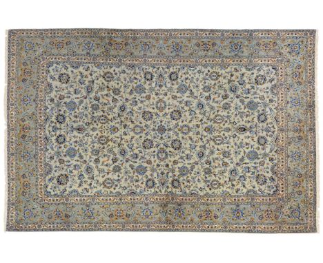 Kashan Carpet Central Iran, circa 1960 The ice blue field with an allover design of scrolling vines and palmettes enclosed by