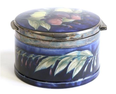 William Moorcroft (British, 1872-1945): A Wisteria Pattern Circular Hinged Trinket Box, with electroplated mounts by William 