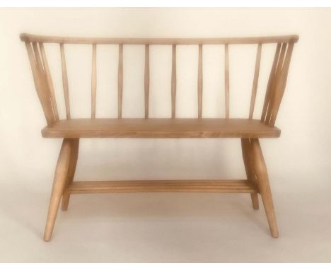 ERCOL STYLE HALL SEAT, mid 20th century elm, with enclosing rail back and solid seat in the manner of 'ERCOL', 88cm W.
