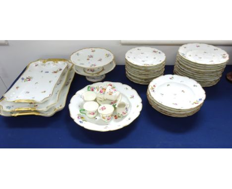 A 20th Century porcelain service decorated with flowers on white ground with a gilt border factory mark CHF, GDM approx thirt