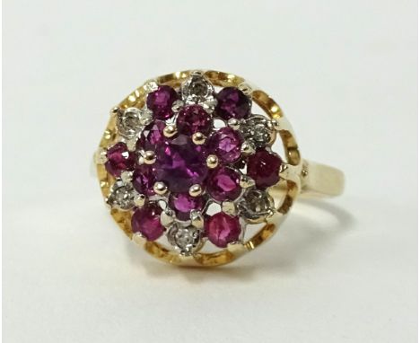 A 9ct gold ruby and diamond cluster ring, size L.