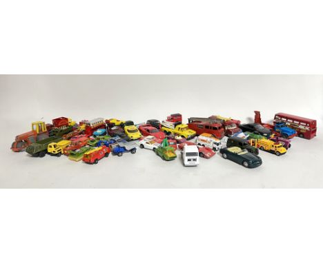 A large collection of toy cars of various models and makes, including miniatures of fire engines, double decker red buses etc