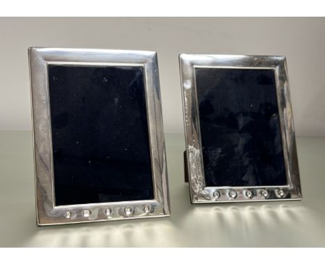 A pair of modern London silver photograph frames with hardwood backs and easel stands London 2000: external  h. x 22cm x l. x
