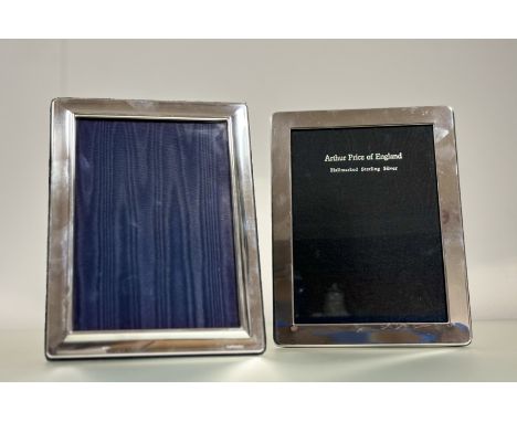 A modern London silver flat framed photograph frame with velvet back and easel stand: external h. x 21.5cm x l. x16.5cm inner