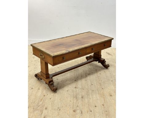 A 19thc mahogany sofa table converted to coffee table, with brass mounted edge, fitted two drawers, on shaped end supports (h