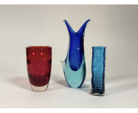 A collection of three decorative glass vases comprising, a  Whitefriars ruby red glass vase (h-17cm), a Whitefriars blue art 
