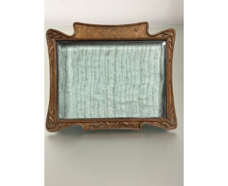 A unusual Arts and crafts oak carved table dispay case with glazed removable front and relief carved boder on easel stand: h.