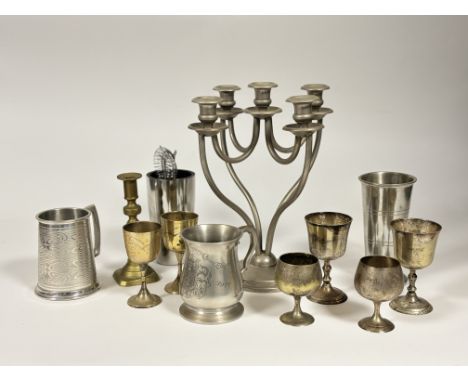 A collection of brass and pewter ware comprising, a four stemmed pewter candelabra, a brass candelstick holder, a pair of sil