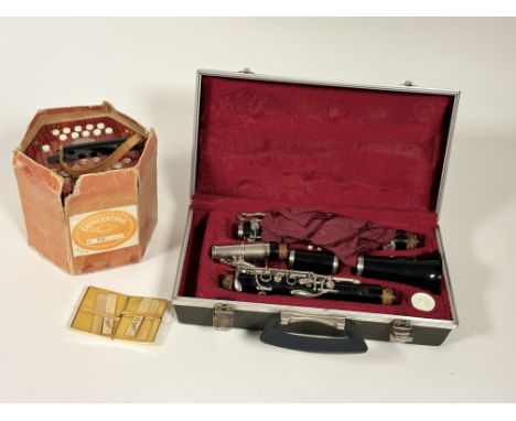 A cased Boosey &amp; Hawkes London Regent clarinet in a fitted red case, a cased set of Vandoren reeds together with a Schole