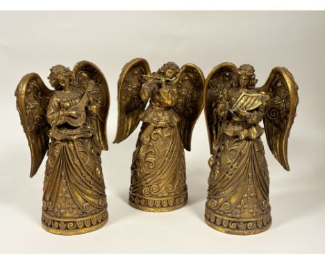A collection of three gilt resin decorative Muscial Angels each playing an instrument such as the harp, a flute and the lute.