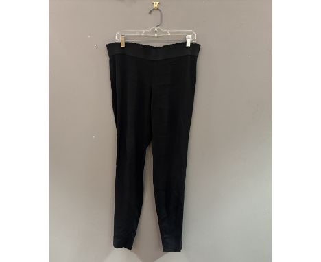 A group of three pairs of black evening trousers, Balenciaga polyester cigarette pants (38), Prada fine wool narrow pants (40
