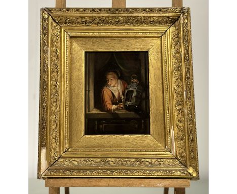 A 19thc Continental School, A Woman in a window holding a lit candle and lantern, oil on board, unsigned, in a gilt frame. (1