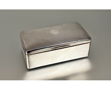 An Edwardian Birmingham silver cigarette box with engine turned decoration and ceder lined interior: h. x 6.5cm x l. x 17.5cm