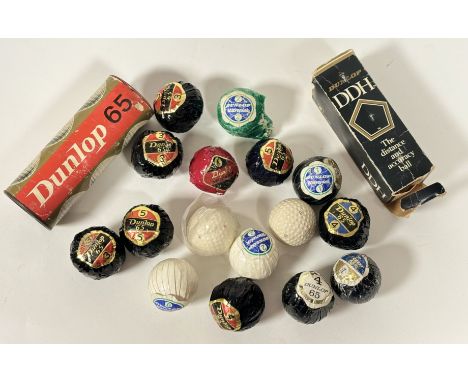 A collection of vintage Dunlop golf balls comprising, various black wrapped 65 golf balls, one green wrapped Warrick 2 golf b