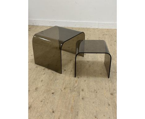 A pair of 1970s smoked arched glass lamp tables (larger: h.45cm)