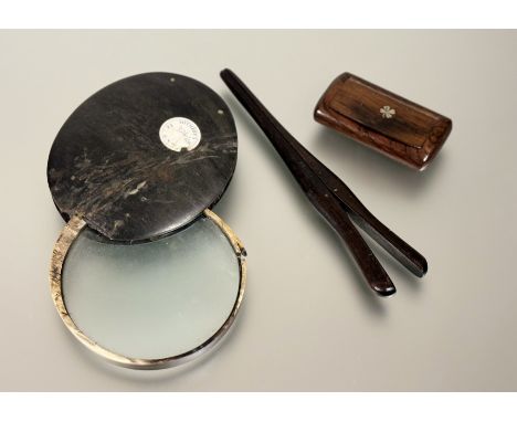 A large 19thc horn cased and mounted table magnifying glass - Ex Sothebys label: d. x 10cm, a rosewood snuff box: l. x 8.5cm 