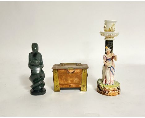 A porcelain glazed pillar candlestick holder with detail of a woman in pink dress playing a musical instrument (h. 20 cm), to