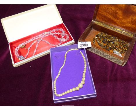 A mosaic jewellery box and contents, tiger eye string beads and a quantity of vintage beads including Swarovski, etc.