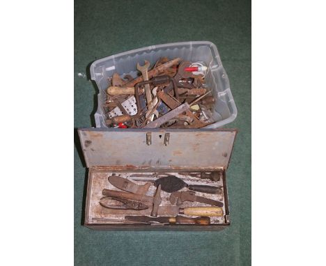 A large collection of various hand tools to include chisels, spanners, hand drill etc housed within a metal tool box (2)