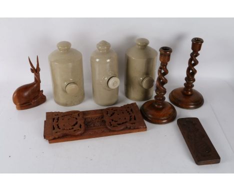 Three stoneware foot warmers, pair of oak barley twist candlesticks, oak barometer, hardwood book rack, wooden ginger bread m