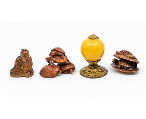 A carved treen netsuke, depicting a crab atop a clam shell, encasing a turtle, approx 4.5cm; a netsuke, carved depicting a fi