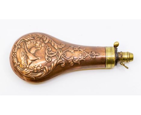 A 19th century brass-mounted copper powder flask, embossed with pheasants and foliate scrolls, approx 19.5cm long