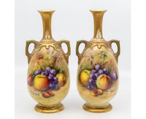 A pair of early 20th Century Royal Worcester two handled vases, shape no: 1762, decorated with fruit with foliage behind, bot