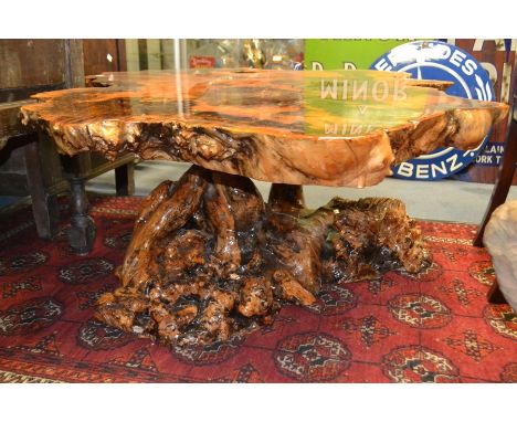 A contemporary rustic burr wood tree trunk naturalistic table, 44cm high, 17cm diameter approx.