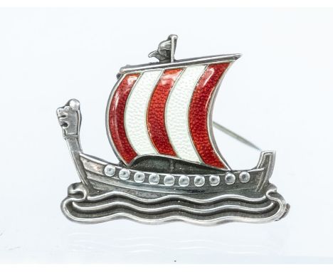 A Danish silver and enamel long ship brooch the sail decorated with red and cream enamel, size approx 35 x 25mm, pin and roll