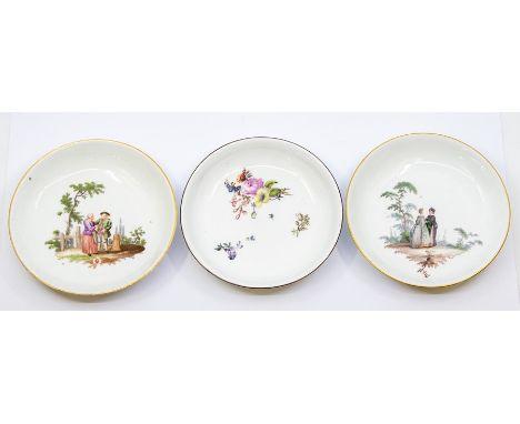 A group of three probably 18th Century Meissen porcelain saucers / bowls, white ground with gilt borders;&nbsp; one painted w