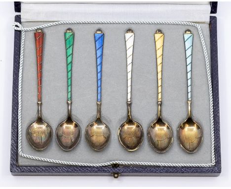 A cased set of six Danish silver gilt enamel demitasse spoons, comprising turquoise, white, red, blue, green and yellow guill
