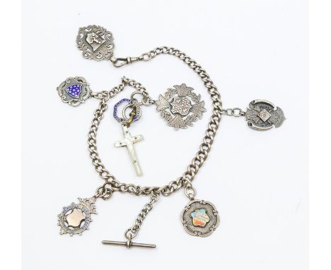 A silver Albert chain along with various medallion and fobs including enamel, gold fronted versions along with a football the