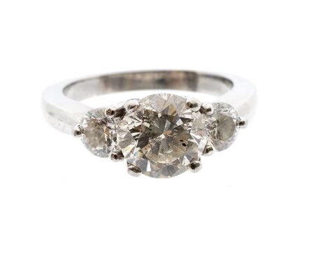 A diamond three stone platinum ring, comprising round brilliant cut diamonds, the principal stone weighing approx 3carats, th