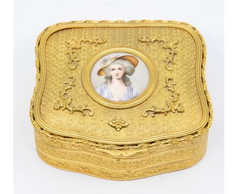 A French gilt metal cartouche shaped jewellery box and cover, the cover inset with porcelain portrait of a Lady, the cover ap