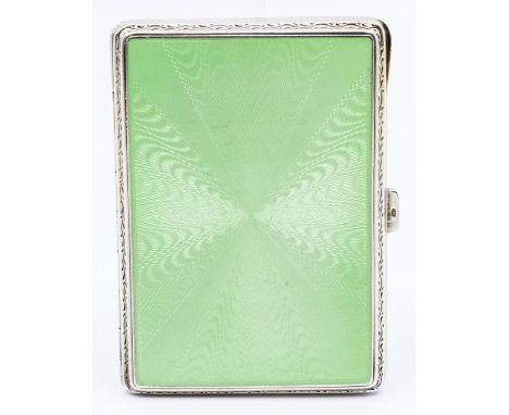 A George V silver and green enamel rectangular cigarette box, the cover with radial decoration, engine turned back, gilt inte